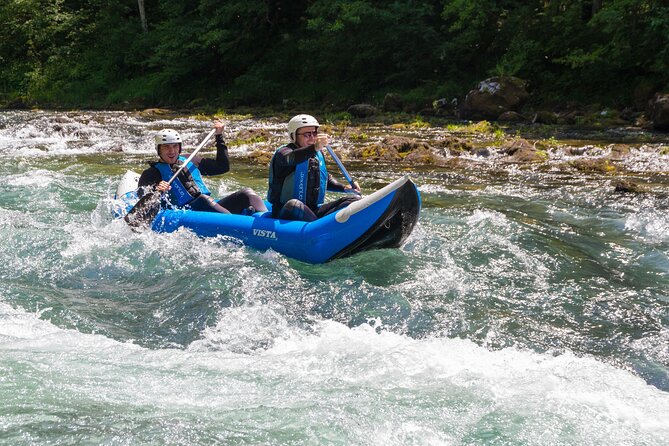 Canoeing Neretva river - Getting fitted with a helmet and neoprene suit